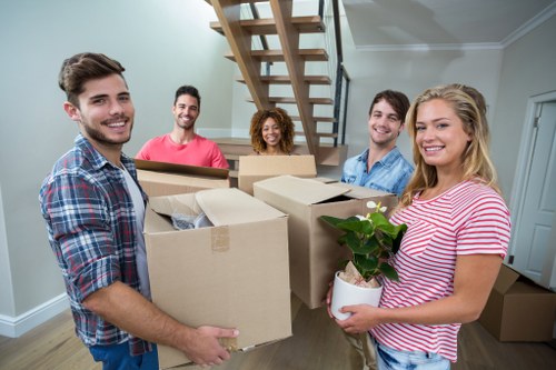 Removal team helping with a house move in Loxford