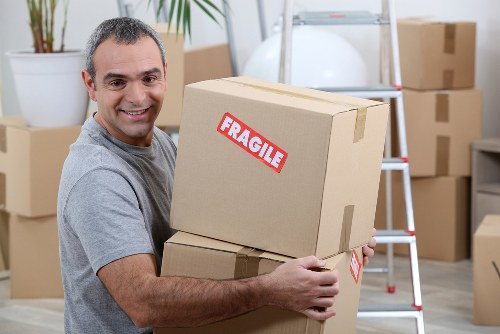 Man with van loading furniture for a local move in Loxford
