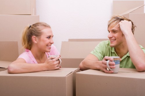 Packing and loading furniture into a moving van in Loxford