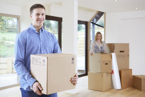 Packed office equipment and labelled boxes prepared for a business move