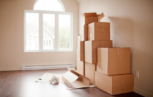 Local moving team loading household items into a van
