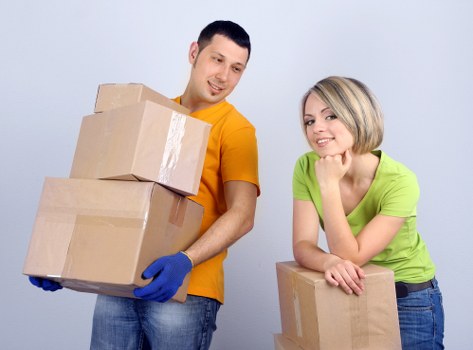 Packed boxes and furniture prepared for removals in Loxford