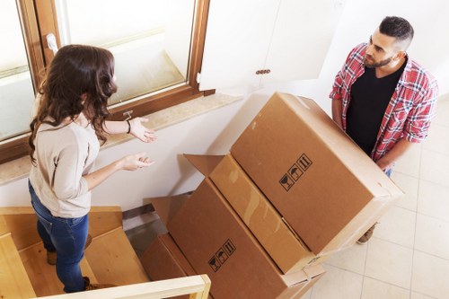 Movers handling a family house move in East London