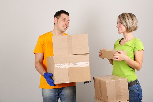 Loading furniture into a van for a move in Loxford