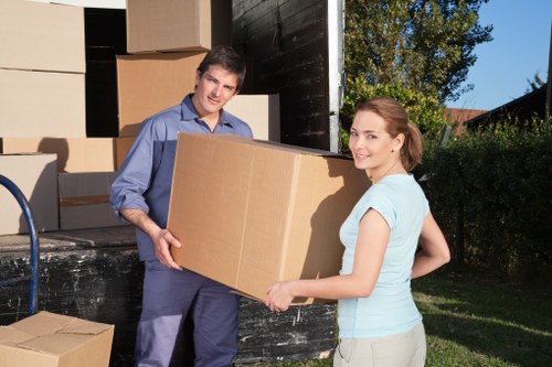 Loading furniture into a van for a local Loxford delivery